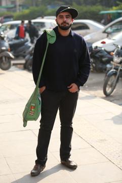 Ketan Mehta of Kirori Mal College poses in his all black attire. (Amal KS/HT)