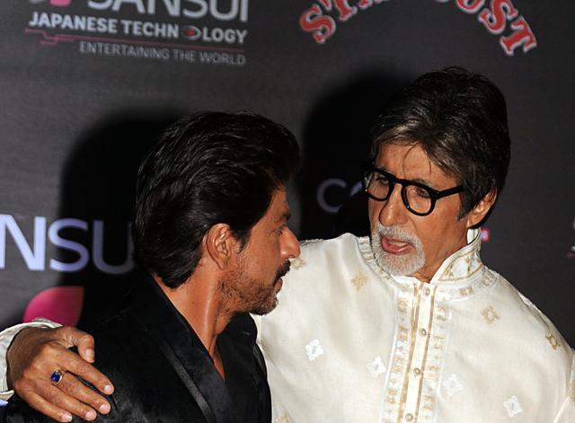 Shah Rukh Khan and Amitabh Bachchan share a moment at the ceremony. (AFP)