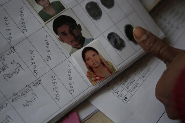 Saro Kumari Mandal gives her fingerprint to receive compensation from the foreign employment promotion board in Kathmandu, Nepal after her husband died as a migrant worker in Qatar. (AP photo) Saro Kumari Mandal gives her fingerprint to receive compensation from the foreign employment promotion board in Kathmandu, Nepal after her husband died as a migrant worker in Qatar. (AP photo)