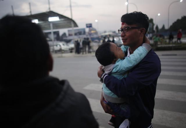 A Nepali migrant worker with his son before departing for Qatar at Tribhuwan International airport in Kathmandu, Nepal. (AP photo) A Nepali migrant worker with his son before departing for Qatar at Tribhuwan International airport in Kathmandu, Nepal. (AP photo)