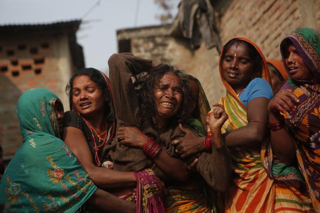 A woman breaks down after seeing the body of her son Balkisun Mandal Khatwe, a migrant worker who died in his sleep in Qatar, at Belhi village in Saptari district, Nepal. (AP photo) A woman breaks down after seeing the body of her son Balkisun Mandal Khatwe, a migrant worker who died in his sleep in Qatar, at Belhi village in Saptari district, Nepal. (AP photo)