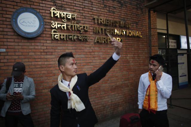 A Nepali man , 23, takes a selfie while he waits for his flight to Malaysia, where he will work in a warehouse as a cleaner, at Tribhuwan International airport in Kathmandu, Nepal. (AP photo) A Nepali man , 23, takes a selfie while he waits for his flight to Malaysia, where he will work in a warehouse as a cleaner, at Tribhuwan International airport in Kathmandu, Nepal. (AP photo)
