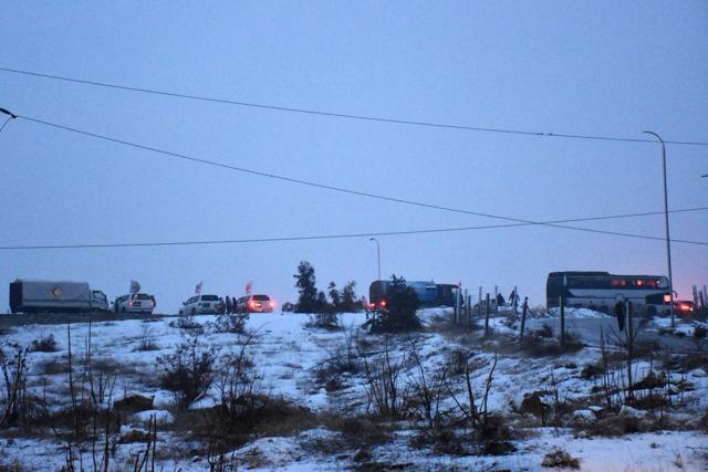 Buses and ambulances are seen during an evacuation operation of Syrian rebel fighters and civilians from the remaining rebel-held pockets of eastern Aleppo towards rebel-held territory in the west of Aleppo's province on December 21, 2016. (AFP) Buses and ambulances are seen during an evacuation operation of Syrian rebel fighters and civilians from the remaining rebel-held pockets of eastern Aleppo towards rebel-held territory in the west of Aleppo's province on December 21, 2016. (AFP)