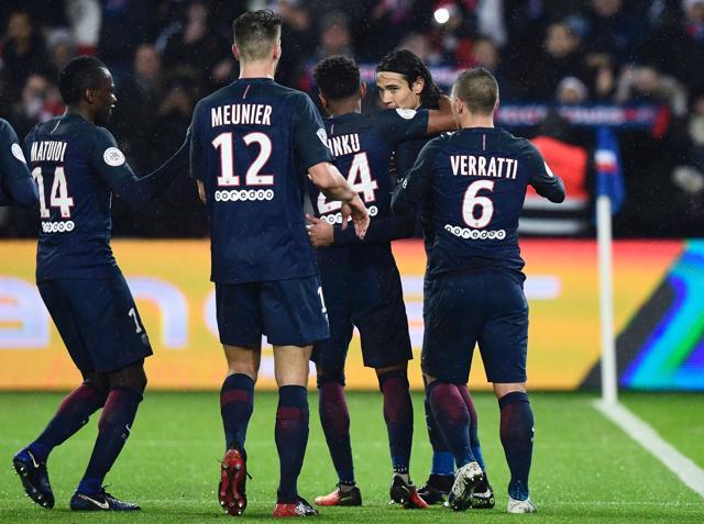 Paris Saint Germainforward Edinson Cavani (C) celebrates with teammates after scoring a penalty. (AFP) Paris Saint Germainforward Edinson Cavani (C) celebrates with teammates after scoring a penalty. (AFP)