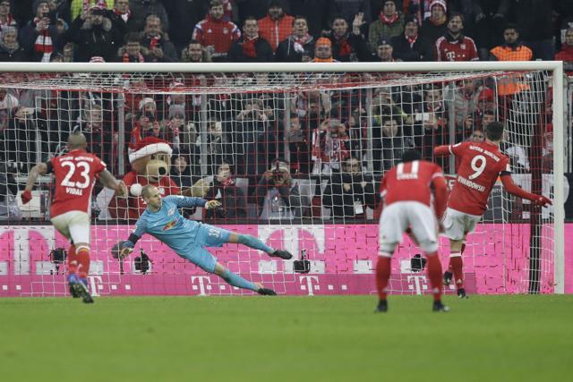 Robert Lewandowski, right, scores from the penalty spot his side's third goal during the German Bundesliga match between FC Bayern Munich and RB Leipzig. (AP) Robert Lewandowski, right, scores from the penalty spot his side's third goal during the German Bundesliga match between FC Bayern Munich and RB Leipzig. (AP)