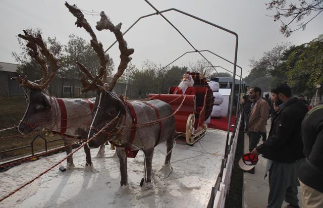 People look a "Christmas peace train" specially decorated by Pakistan Railways for Christmas celebrations, at Margalla railway station in Islamabad. (AP) People look a "Christmas peace train" specially decorated by Pakistan Railways for Christmas celebrations, at Margalla railway station in Islamabad. (AP)