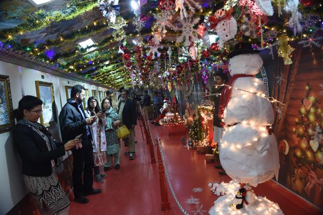 Pakistani people visit a Christmas-themed train. (AFP) Pakistani people visit a Christmas-themed train. (AFP)
