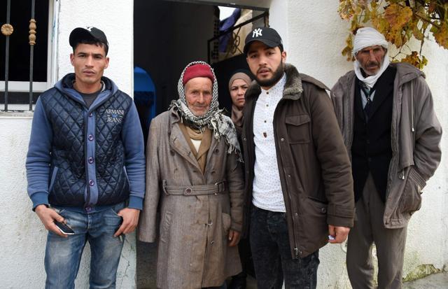 Mustapha Amri (2ndL), the father of 24-year-old Anis Amri, the prime suspect in Berlin's deadly truck attack, poses next to his children Walid (L), Hanan (C), and Abdelkader and his brother (R) in front the family house in the town of Oueslatia, in Tunisia's region of Kairouan on December 22, 2016. (AFP) Mustapha Amri (2ndL), the father of 24-year-old Anis Amri, the prime suspect in Berlin's deadly truck attack, poses next to his children Walid (L), Hanan (C), and Abdelkader and his brother (R) in front the family house in the town of Oueslatia, in Tunisia's region of Kairouan on December 22, 2016. (AFP)