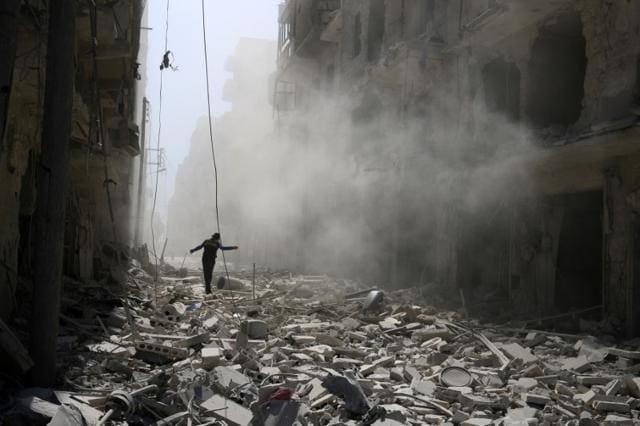 A man walks on the rubble of damaged buildings after an airstrike on the rebel held al-Qaterji neighbourhood of Aleppo. (Reuters/Abdalrhman Ismail) A man walks on the rubble of damaged buildings after an airstrike on the rebel held al-Qaterji neighbourhood of Aleppo. (Reuters/Abdalrhman Ismail)