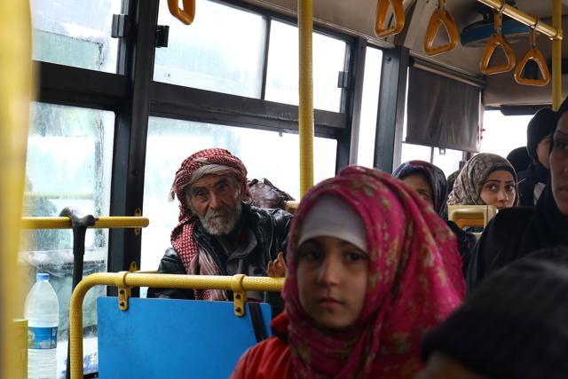 Evacuees from the Shi'ite Muslim villages of al-Foua and Kefraya ride a bus at insurgent-held al-Rashideen in the province of Aleppo, Syria. (Reuters Photo) Evacuees from the Shi'ite Muslim villages of al-Foua and Kefraya ride a bus at insurgent-held al-Rashideen in the province of Aleppo, Syria. (Reuters Photo)