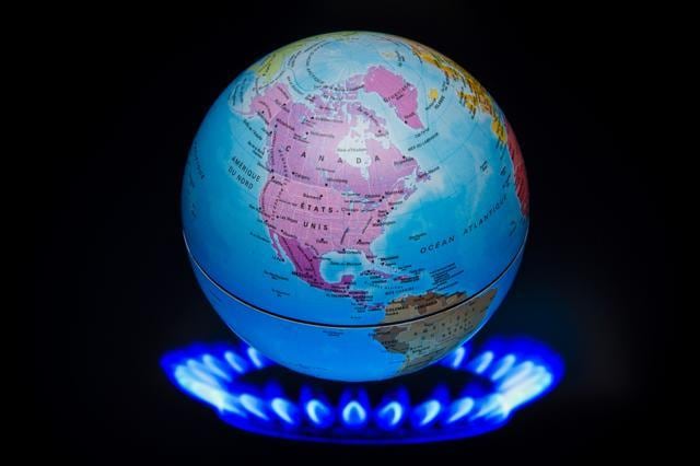 A small globe above flames of a gas ring to illustrate global warming. (AFP file photo) A small globe above flames of a gas ring to illustrate global warming. (AFP file photo)
