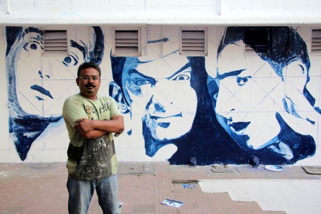 Bollywood Art Project founder and artist, Ranjit Dahiya against a Dil Chahta Hai mural at IIT Mumbai, Powai. (HT File Photo)