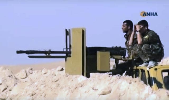 This frame grab from video provided on November 7, 2016, shows US-backed fighters take position during fighting with the Islamic State group in a village of Raqqa in Syria. (AP) This frame grab from video provided on November 7, 2016, shows US-backed fighters take position during fighting with the Islamic State group in a village of Raqqa in Syria. (AP)