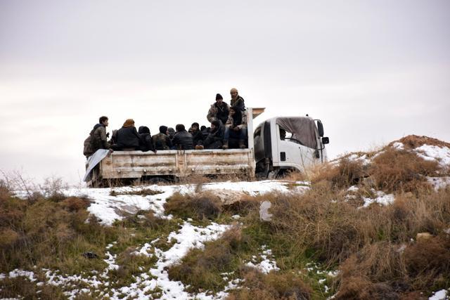 Syrian rebel fighters are evacuated from Aleppo towards rebel-held territory in the west of Aleppo's province. (AFP Photo) Syrian rebel fighters are evacuated from Aleppo towards rebel-held territory in the west of Aleppo's province. (AFP Photo)