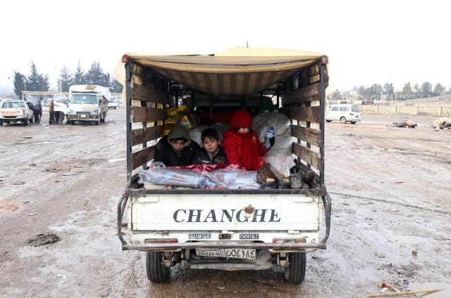 Syrians, who left the last rebel-held pockets of Syria's northen city of Aleppo, arrive on December 22, 2016 in the opposition-controlled Khan al-Assal region, west of the embattled city. (AFP Photo/Baraa al-Halabi) Syrians, who left the last rebel-held pockets of Syria's northen city of Aleppo, arrive on December 22, 2016 in the opposition-controlled Khan al-Assal region, west of the embattled city. (AFP Photo/Baraa al-Halabi)