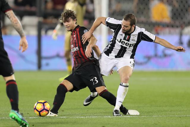 AC Milan's Alessio Romagnoli vies for the ball with Juventus' Gonzalo Higuain. (AFP) AC Milan's Alessio Romagnoli vies for the ball with Juventus' Gonzalo Higuain. (AFP)