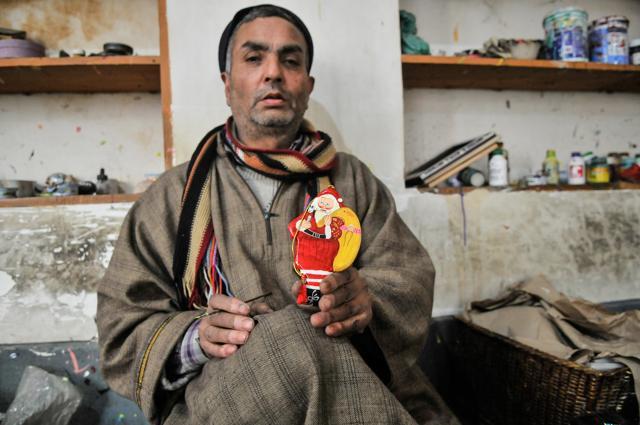 Barkat Ali seen here holding a Santa Claus decoration said he has not encouraged his children to become papier mâché artists. (Waseem Andrabi/HT Photo) Barkat Ali seen here holding a Santa Claus decoration said he has not encouraged his children to become papier mâché artists. (Waseem Andrabi/HT Photo)