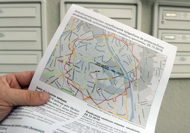 This picture shows an evacuation leaflet on December 24, 2016 in Augsburg, southern Germany. The lettering reads: "Danger zone. Do Not Enter" (AFP Photo) This picture shows an evacuation leaflet on December 24, 2016 in Augsburg, southern Germany. The lettering reads: "Danger zone. Do Not Enter" (AFP Photo)
