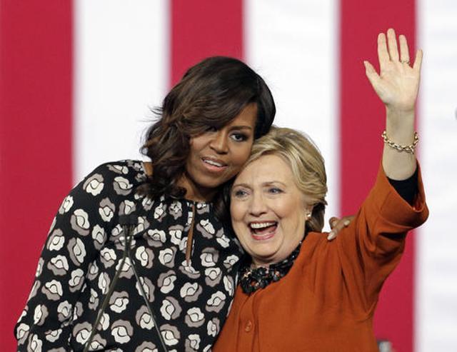 Democratic presidential candidate Hillary Clinton is hugged by first lady Michelle Obama during a campaign rally in Winston,Salem. (AP File Photo) Democratic presidential candidate Hillary Clinton is hugged by first lady Michelle Obama during a campaign rally in Winston,Salem. (AP File Photo)