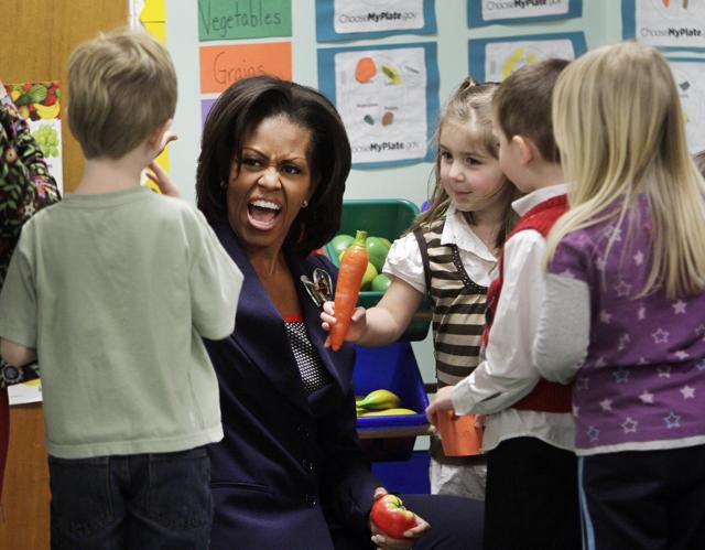 First lady Michelle Obama gives a high five during a stop with pre-schoolers at the Penacook Community Centervin Concord, as part of her Let's Move initiative. (AP File Photo) First lady Michelle Obama gives a high five during a stop with pre-schoolers at the Penacook Community Centervin Concord, as part of her Let's Move initiative. (AP File Photo)