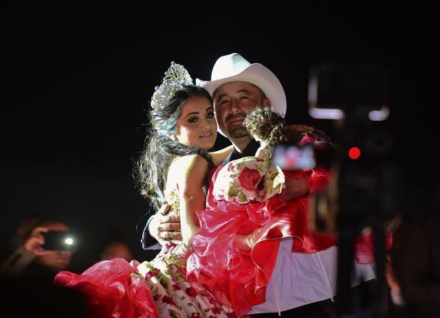 Rubi Ibarra and her father Cresencio Ibarra dance during the celebration of her 15th birthday in Villa Guadalupe, San Luis Potosi State. (AFP Photo) Rubi Ibarra and her father Cresencio Ibarra dance during the celebration of her 15th birthday in Villa Guadalupe, San Luis Potosi State. (AFP Photo)