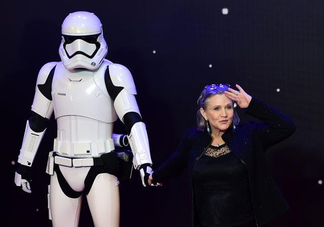 Carrie Fisher (right) poses with a storm trooper as she attends the opening of the European Premiere of "Star Wars: The Force Awakens" in central London. (AFP File Photo) Carrie Fisher (right) poses with a storm trooper as she attends the opening of the European Premiere of "Star Wars: The Force Awakens" in central London. (AFP File Photo)