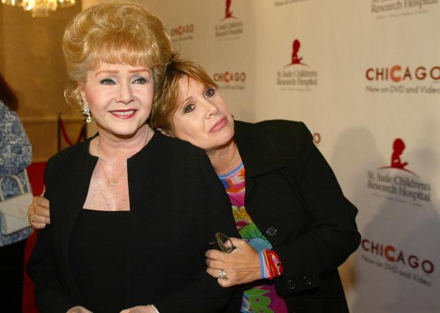 Debbie Reynolds and daughter Carrie Fisher arrive at a charity event in Beverly Hills, California, in August 2003. (AP File Photo) Debbie Reynolds and daughter Carrie Fisher arrive at a charity event in Beverly Hills, California, in August 2003. (AP File Photo)