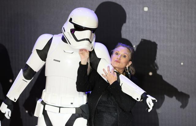 Actress Carrie Fisher with a Storm Trooper at the opening of the European premiere of ‘Star Wars: The Force Awakens’ in central London on December 16, 2015. Fisher reprised her role as Princess Leia in the film, more than a decade after her last appearance in the franchise. (Reuters File) Actress Carrie Fisher with a Storm Trooper at the opening of the European premiere of ‘Star Wars: The Force Awakens’ in central London on December 16, 2015. Fisher reprised her role as Princess Leia in the film, more than a decade after her last appearance in the franchise. (Reuters File)