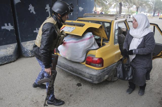 Iraqi security forces search cars in Baghdad's southwestern Saydiyah neighbourhood a day after journalist Afrah Shawqi al-Qaisi was kidnapped, in Baghdad, Iraq. (AP Photo) Iraqi security forces search cars in Baghdad's southwestern Saydiyah neighbourhood a day after journalist Afrah Shawqi al-Qaisi was kidnapped, in Baghdad, Iraq. (AP Photo)