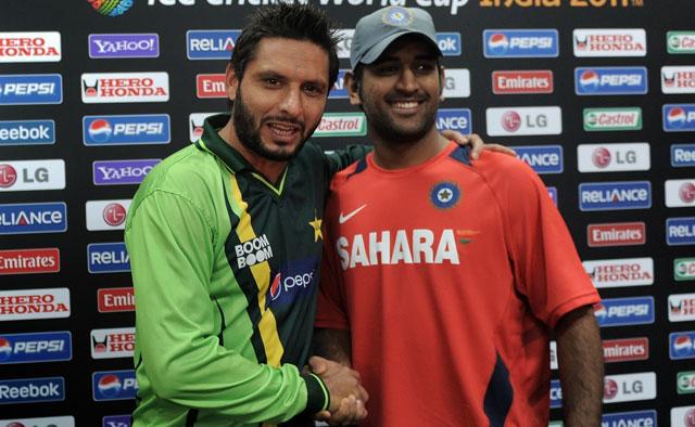 In spite of poor diplomatic relationship between India and Pakistan, players remain good friends as this photo of Mahendra Singh Dhoni and Shahid Afridi shows (AP) In spite of poor diplomatic relationship between India and Pakistan, players remain good friends as this photo of Mahendra Singh Dhoni and Shahid Afridi shows (AP)