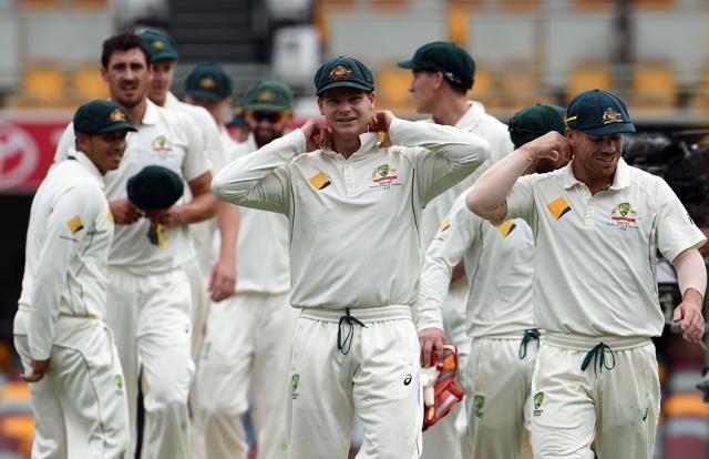 Steve Smith (C) adjusts his collar as he walks off the field with teammates after beating Pakistan in the first day-night cricket Test against Pakistan in Brisbane. (AFP) Steve Smith (C) adjusts his collar as he walks off the field with teammates after beating Pakistan in the first day-night cricket Test against Pakistan in Brisbane. (AFP)