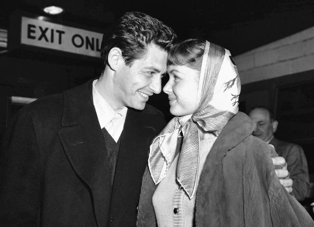 In this April 19, 1955, file photo, singer Eddie Fisher and his fiancee, actress Debbie Reynolds, look at each other at Idlewild Airport in New York. (AP) In this April 19, 1955, file photo, singer Eddie Fisher and his fiancee, actress Debbie Reynolds, look at each other at Idlewild Airport in New York. (AP)