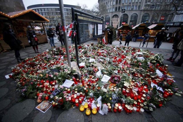 Flowers and candles are placed near the Christmas market at Breitscheid square in Berlin. (Reuters) Flowers and candles are placed near the Christmas market at Breitscheid square in Berlin. (Reuters)