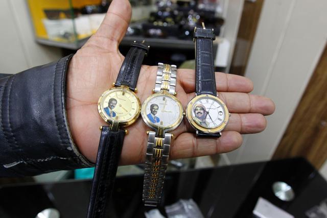 An Iraqi shopkeeper holds watches bearing portraits of late Iraqi president Saddam Hussein at his shop in Baghdad. (AFP photo) An Iraqi shopkeeper holds watches bearing portraits of late Iraqi president Saddam Hussein at his shop in Baghdad. (AFP photo)