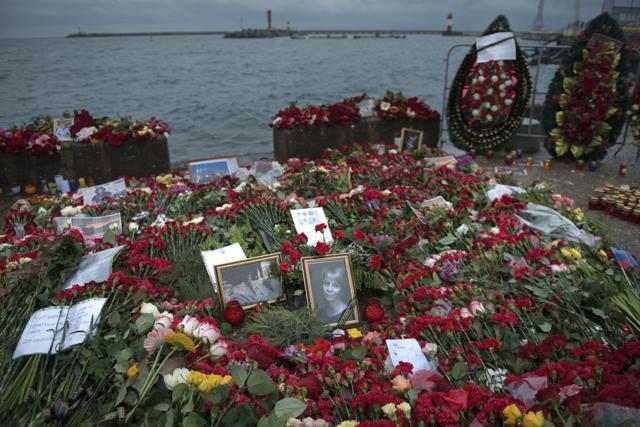 Flowers, candles, portraits placed at a pier in honour of the victims of the military plane crash, in Sochi, Russia. (AP photo) Flowers, candles, portraits placed at a pier in honour of the victims of the military plane crash, in Sochi, Russia. (AP photo)
