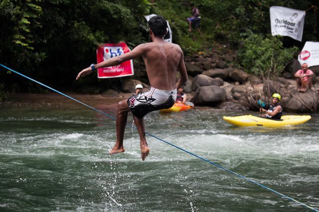 Slacklining lets you be a daredevil on a tightrope, with far fewer risks. In waterlining, the form of slacklining seen above, you jump about and perform tricks on a rope suspended just above the water. Slacklining lets you be a daredevil on a tightrope, with far fewer risks. In waterlining, the form of slacklining seen above, you jump about and perform tricks on a rope suspended just above the water.