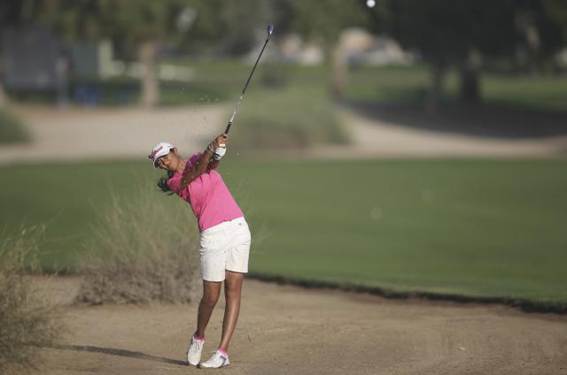 Aditi Ashok of India plays a shot on the 10th hole during the revised 2nd round of Dubai Ladies Masters golf tournament in Dubai. (AP) Aditi Ashok of India plays a shot on the 10th hole during the revised 2nd round of Dubai Ladies Masters golf tournament in Dubai. (AP)