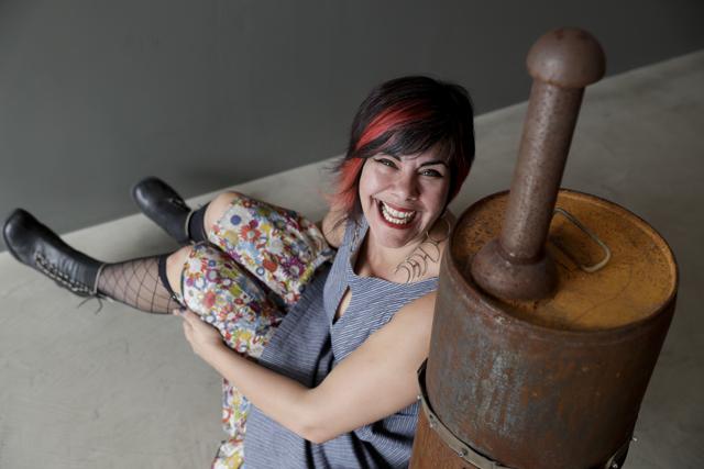 Amber Clisura poses next to the meat smoker she donated to the Museum. (AP) Amber Clisura poses next to the meat smoker she donated to the Museum. (AP)