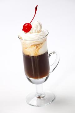 Closeup of tasty B-52 Coffee Cocktail, Baileys, Grand Marnier, Kahlua, coffee, whipped cream and maraschino cherry - coffee warmers series. (iStockphoto) Closeup of tasty B-52 Coffee Cocktail, Baileys, Grand Marnier, Kahlua, coffee, whipped cream and maraschino cherry - coffee warmers series. (iStockphoto)