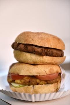 The DePauls' veg and chicken burgers in New Delhi. Its loyal customers love the fried burgers (Saumya Khandelwal/HT ) The DePauls' veg and chicken burgers in New Delhi. Its loyal customers love the fried burgers (Saumya Khandelwal/HT )