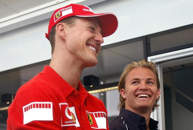 In this picture taken on April 20, 2006 Ferrari driver Michael Schumacher, left, of Germany, and fellow-countryman Nico Rosberg, of Williams, talk at the Dino and Enzo Ferrari racetrack in Imola, Italy. (AP)