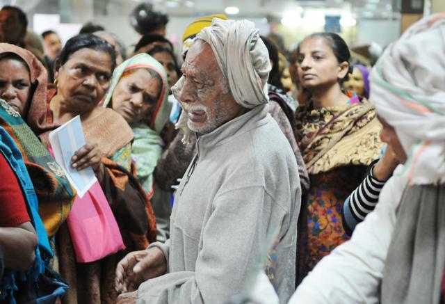 The image of retired armyman Nand Lal weeping at State Bank of India in New Colony was widely shared on social media and he represented the plight of the common man after the note ban. (HT File) The image of retired armyman Nand Lal weeping at State Bank of India in New Colony was widely shared on social media and he represented the plight of the common man after the note ban. (HT File)
