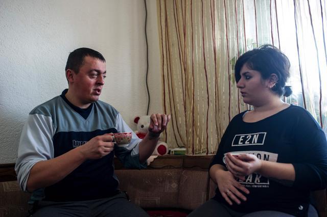 Noora Arkavazi (R) and her husband Bobi Dodevski speak in their home in Kumanovo. (AFP Photo)