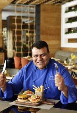 “A real burger is a tenderloin burger. You should be able to taste the meat. What people do wrong is to pile in too much of celery and onion,” says Shangri-La's executive chef Neeraj Tyagi. (Saumya Khandelwal/HT) “A real burger is a tenderloin burger. You should be able to taste the meat. What people do wrong is to pile in too much of celery and onion,” says Shangri-La's executive chef Neeraj Tyagi. (Saumya Khandelwal/HT)