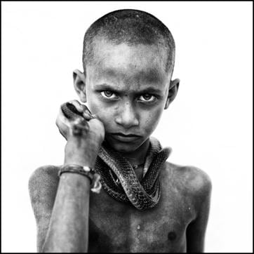 Children of Jogi Dera, a village near Kanpur, play with snakes. That’s natural, for the village belongs to a semi-nomadic tribe, ‘Baiga’ or ‘Sapera’, whose main occupation is snake charming. (Arun Sharma/ HT Photo) Children of Jogi Dera, a village near Kanpur, play with snakes. That’s natural, for the village belongs to a semi-nomadic tribe, ‘Baiga’ or ‘Sapera’, whose main occupation is snake charming. (Arun Sharma/ HT Photo)