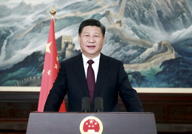 Chinese President Xi Jinping speaks during a New Year greetings broadcasted in Beijing. Xi said his government will continue to focus on poverty alleviation at home and resolutely defend China's territorial rights on the foreign front. (AP) Chinese President Xi Jinping speaks during a New Year greetings broadcasted in Beijing. Xi said his government will continue to focus on poverty alleviation at home and resolutely defend China's territorial rights on the foreign front. (AP)