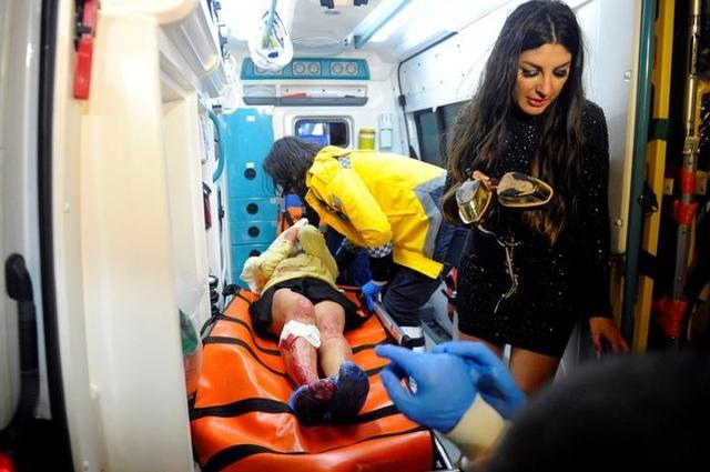 An injured woman is carried to an ambulance from a nightclub where a gun attack took place during a New Year party in Istanbul, Turkey, January 1, 2017. (Reuters) An injured woman is carried to an ambulance from a nightclub where a gun attack took place during a New Year party in Istanbul, Turkey, January 1, 2017. (Reuters)