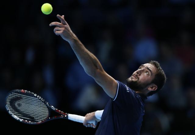 Croatia's Marin Cilic serves to Switzerland's Stan Wawrinka during their ATP World Tour Finals singles tennis match. (AP) Croatia's Marin Cilic serves to Switzerland's Stan Wawrinka during their ATP World Tour Finals singles tennis match. (AP)