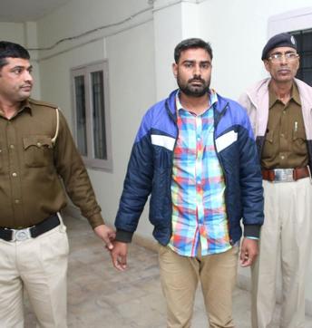 The person accused of throwing a shoe at Arvind Kejriwal in police custody. (Manoj Dhaka/HT Photo) The person accused of throwing a shoe at Arvind Kejriwal in police custody. (Manoj Dhaka/HT Photo)