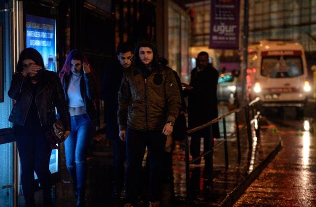 People flee from a nightclub where a gun attack took place during a New Year party in Istanbul. (REUTERS) People flee from a nightclub where a gun attack took place during a New Year party in Istanbul. (REUTERS)